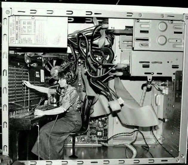 A visual collage placing a historical operator inside a desktop computer case.